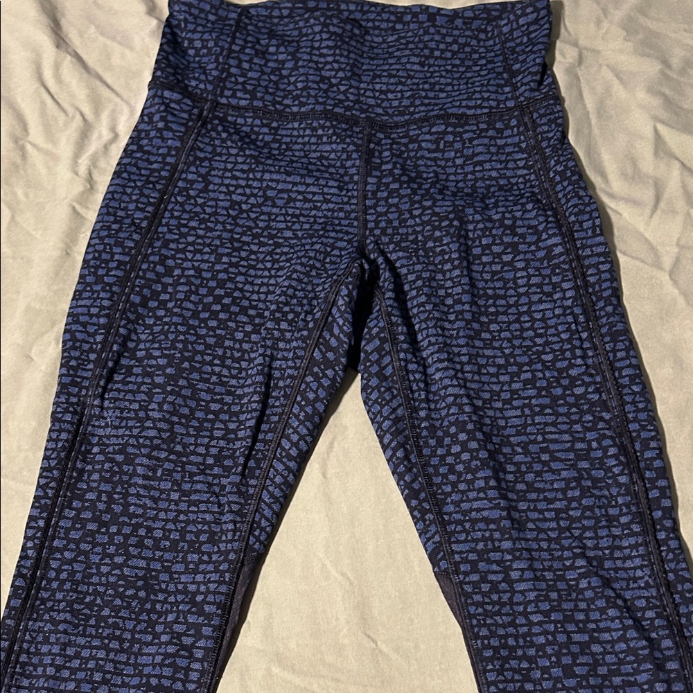 Lululemon workout wear with mesh on bottom back legs